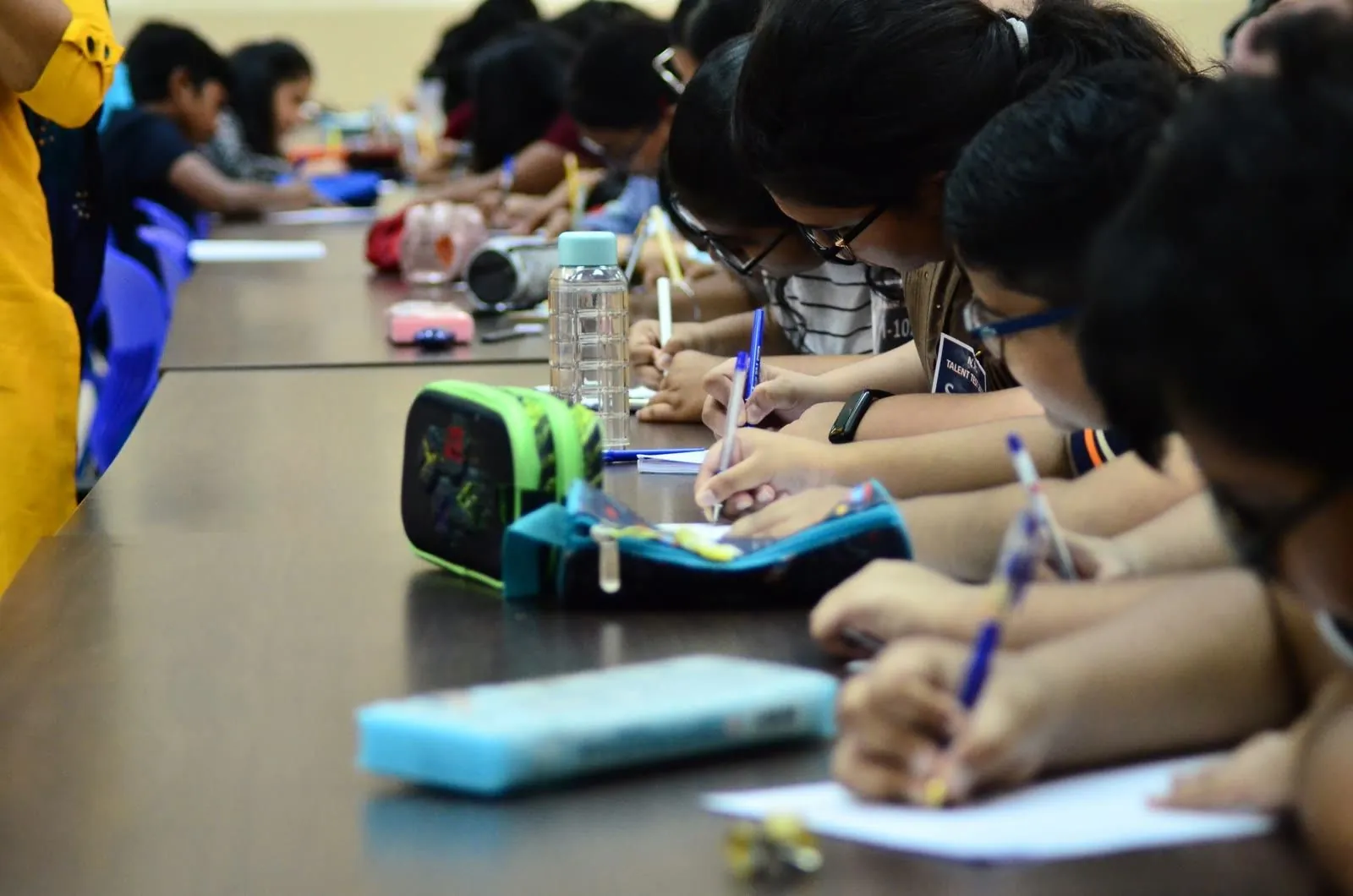 Children writing their Sunday School exams